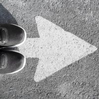 flat-lay-arrow-asphalt-shoes